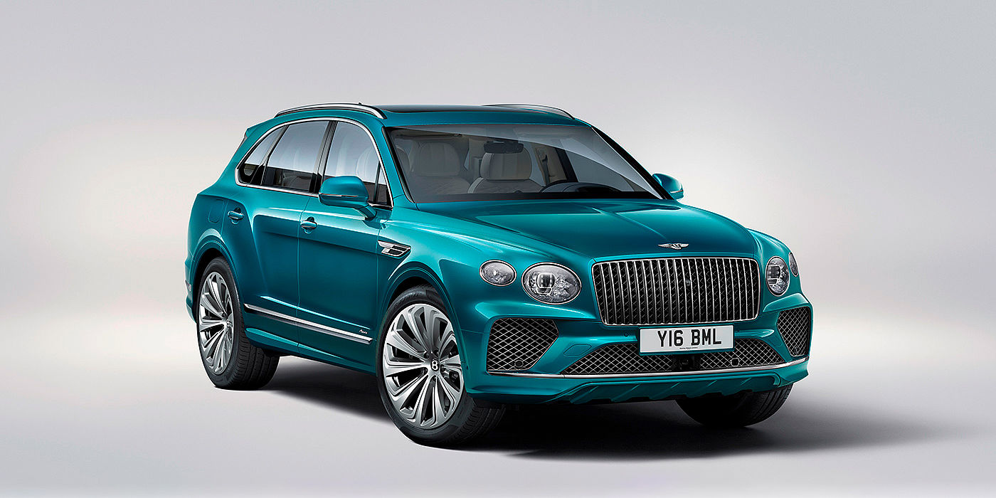 Bach Premium Cars GmbH Bentley Bentayga Azure front three-quarter view, featuring a fluted chrome grille with a matrix lower grille and chrome accents in Topaz blue paint.