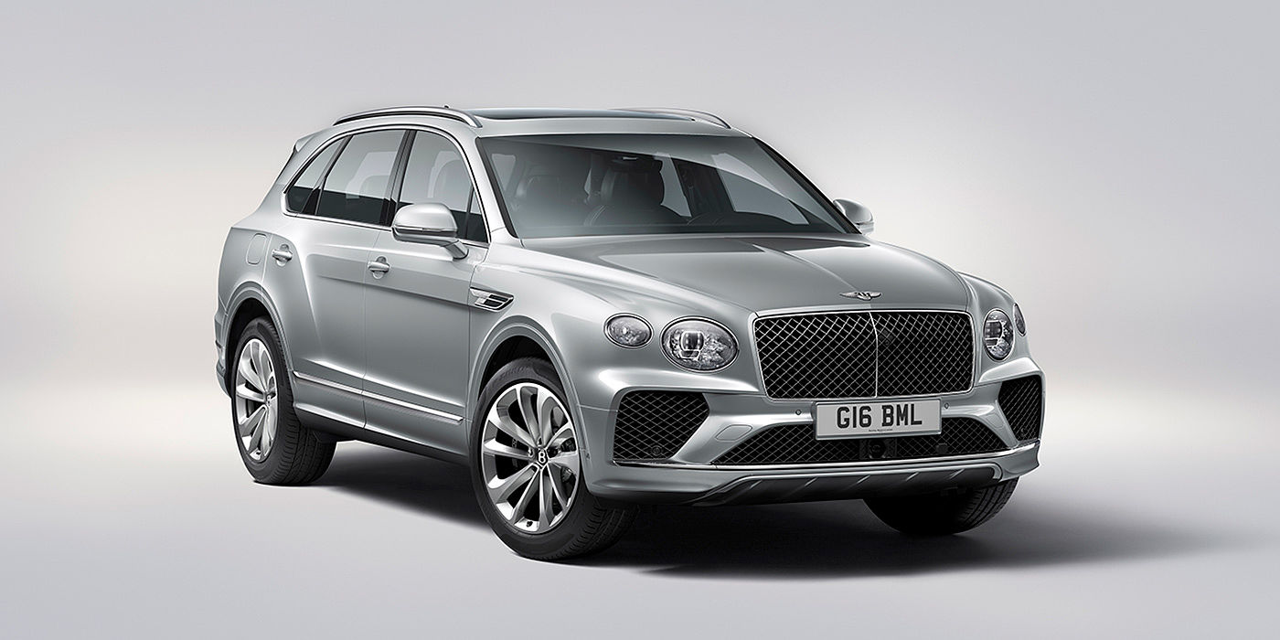Bach Premium Cars GmbH Bentley Bentayga in Moonbeam paint, front three-quarter view, featuring a matrix grille and elliptical LED headlights.