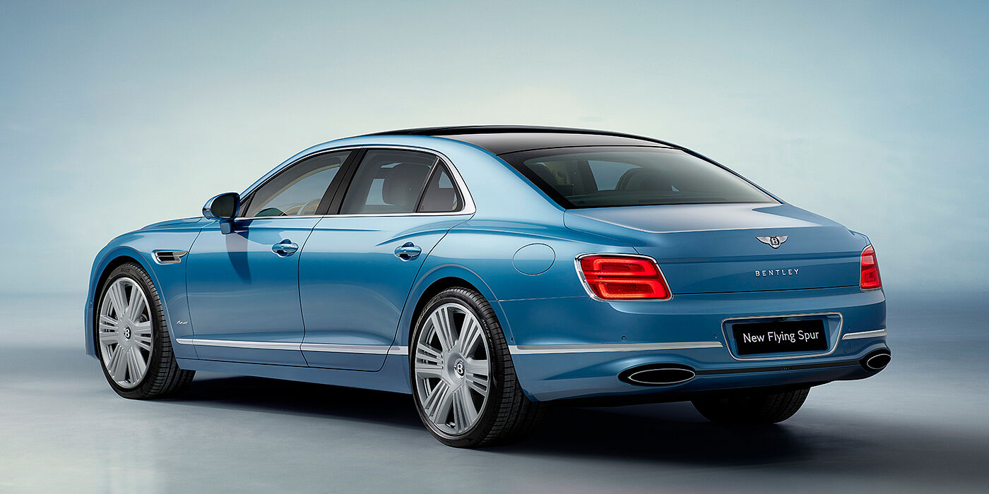 Bach Premium Cars GmbH New Bentley Flying Spur Azure sedan rear view in Light windsor blue by Mulliner paint with 22 inch Azure wheels and chrome exterior details
