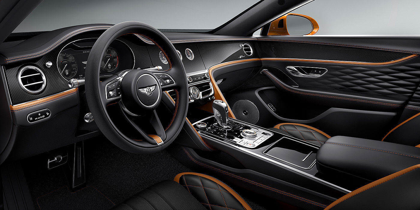 Bach Premium Cars GmbH Bentley Flying Spur Speed driver's view - featuring Single Tone, 3 spoke steering wheel in High Gloss Carbon Fibre veneer.