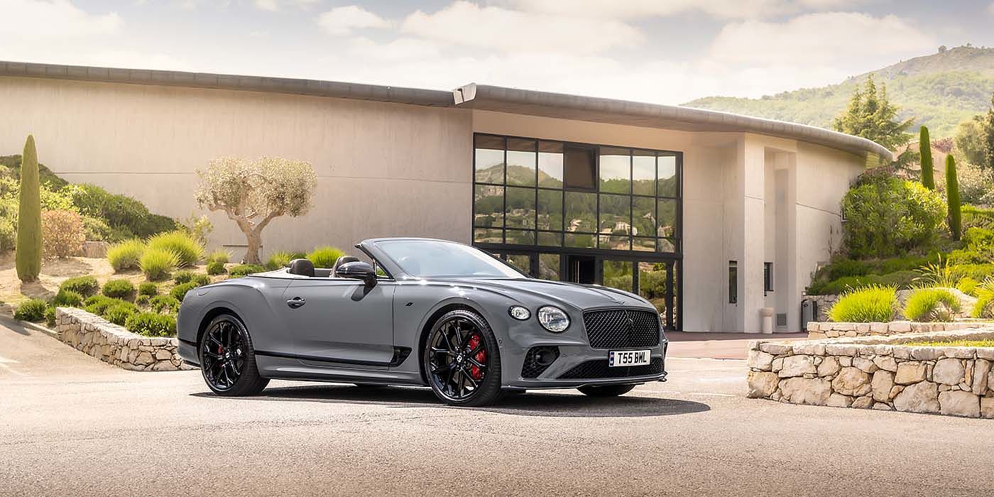 Bach Premium Cars GmbH Bentley Continental GTC S convertible in Cambrian Grey paint front 34 static near house
