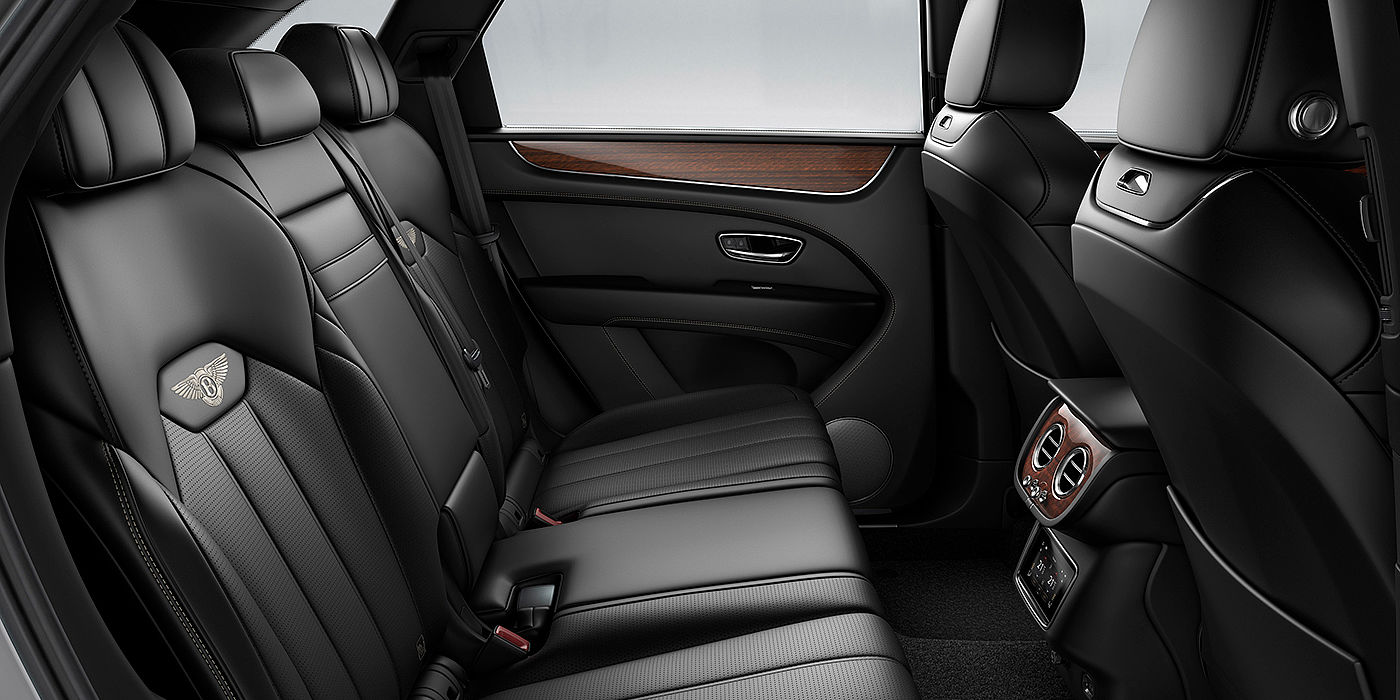 Bach Premium Cars GmbH Bentey Bentayga interior view for rear passengers with Beluga black hide.