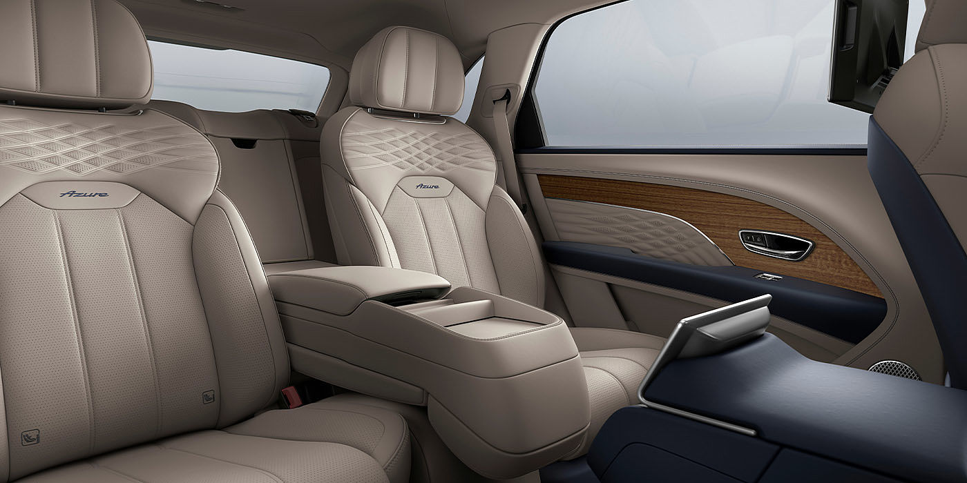 Bach Premium Cars GmbH Bentley Bentayga EWB Azure interior view for rear passengers with Portland hide featuring Azure Emblem in Imperial Blue contrast stitch.