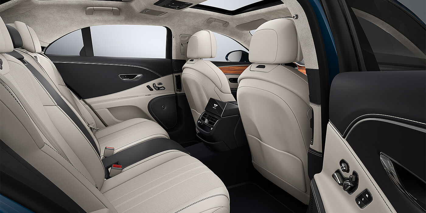 Bach Premium Cars GmbH New Bentley Flying Spur sedan rear interior in Linen and Imperial Blue hides with Open Pore Koa veneer
