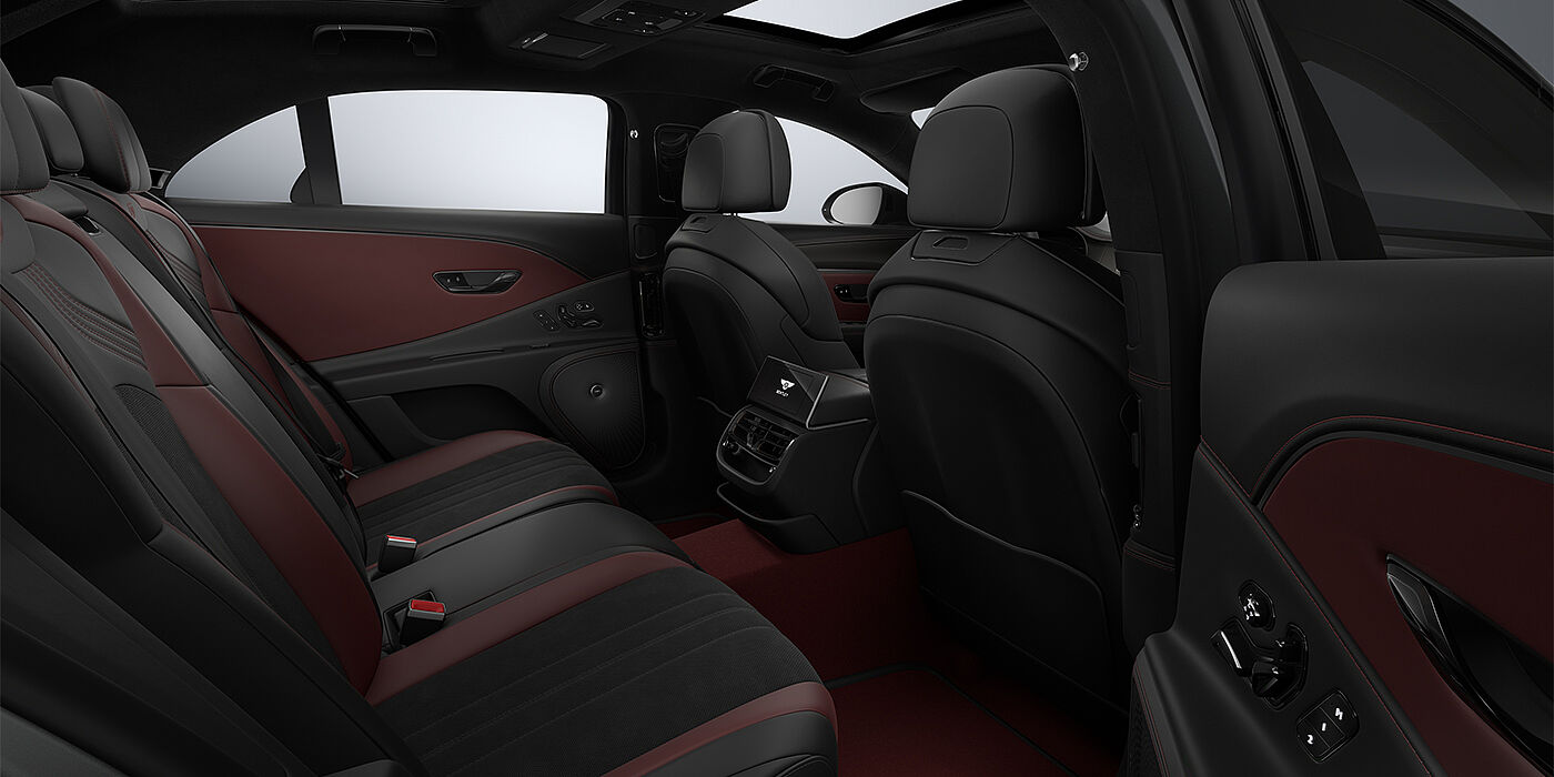 Bach Premium Cars GmbH New Bentley Flying Spur S sedan rear interior in Cricket Ball red  and Beluga black hides with High Gloss Carbon Fibre veneer