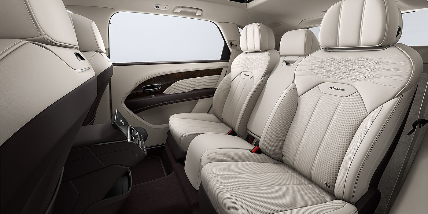 Bach Premium Cars GmbH Bentley Bentayga EWB Azure SUV rear interior in Linen and Burnt Oak hides and Azure seat stitching