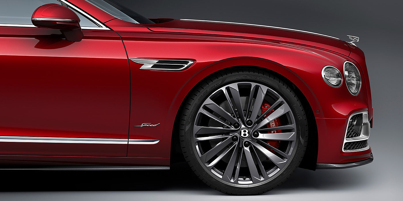 Bach Premium Cars GmbH Bentley Flying Spur Speed sedan front wheel in close up with Dragon Red II paint