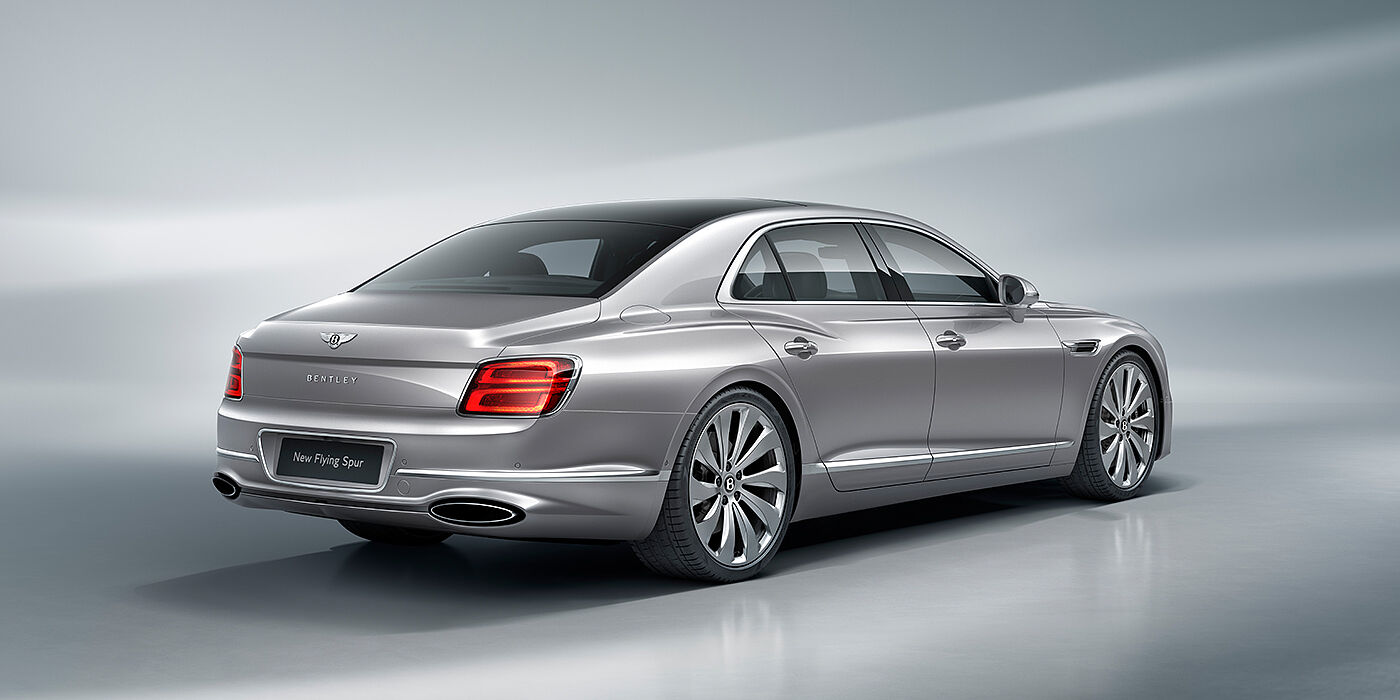 Bach Premium Cars GmbH New Bentley Flying Spur sedan rear view in Silverlake paint with ten spoke wheels and chrome matrix grille