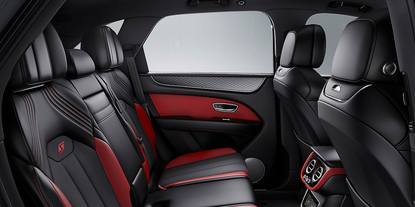 Bach Premium Cars GmbH Bentey Bentayga S interior view for rear passengers with Beluga black and Hotspur red coloured hide.