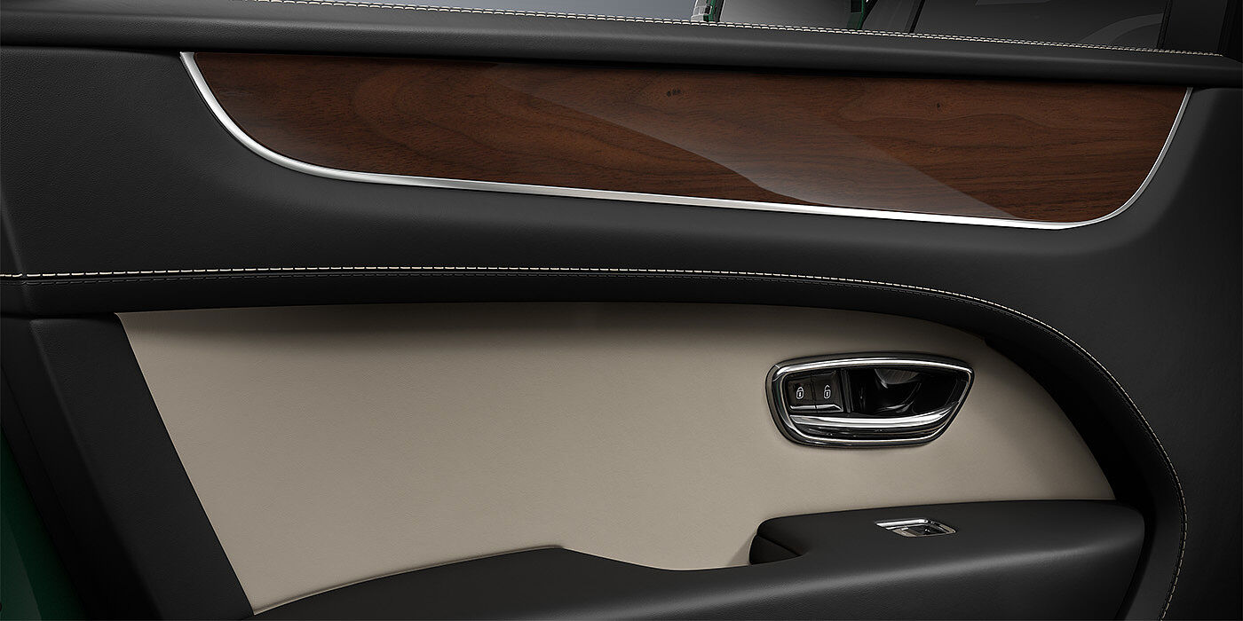 Bach Premium Cars GmbH Bentley Bentayga SUV door interior detail in Portland and Beluga black hides with Crown Cut Walnut veneer