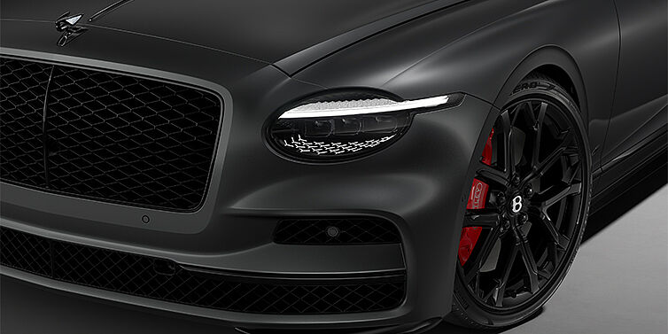 Bach Premium Cars GmbH New Bentley Flying Spur S sedan head lamp against Anthracite Satin paint with  22" Sports wheel