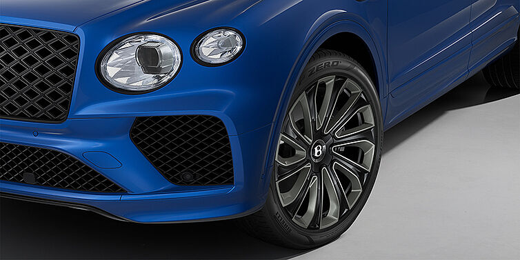 Bach Premium Cars GmbH Bentley Bentayga Artenara Edition SUV front detail in Sequin Blue paint and 22" Mulliner Gloss Black wheels front 3/4