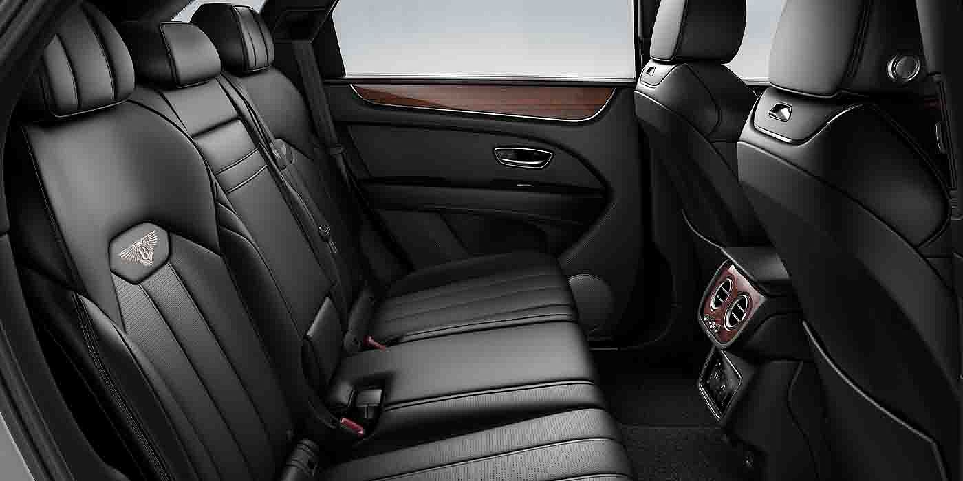 Bach Premium Cars GmbH Bentley Bentayga EWB interior view for rear passengers with Beluga black hide.
