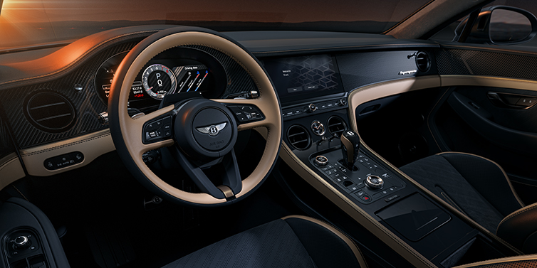 Bach Premium Cars GmbH Bentley Supersports front interior in Beluga and Camel hides with Bronze accents and high gloss black carbon fibre veneer.