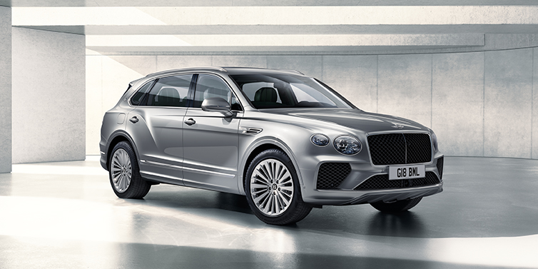 Bach Premium Cars GmbH Bentley Bentayga Extended Wheelbase SUV front three quarter in Moonbeam paint with a grey background