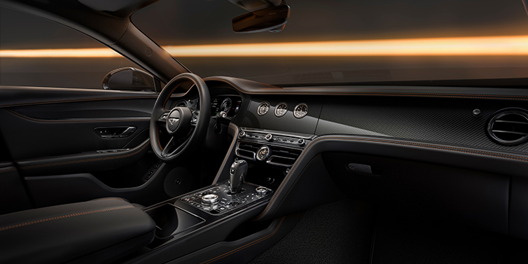Bach Premium Cars GmbH Bentley Flying Spur Black Edition sedan front interior in Beluga black hide with High Gloss Carbon Fibre veneer