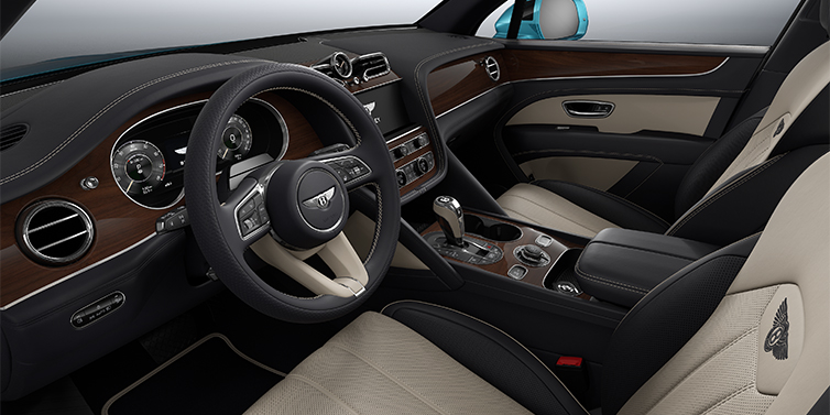 Bach Premium Cars GmbH Bentley Bentayga EWB SUV front interior in Portland and Imperial Blue hides with Crown Cut Walnut veneer
