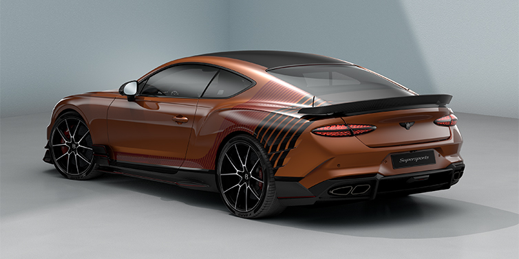 Bach Premium Cars GmbH Bentley Supersports rear three quarter in "Meteorite" Design theme with Orange Flame paint and Beluga Black and Candy Red paint stripes across the rear haunch.