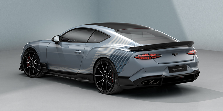 Bach Premium Cars GmbH Bentley Supersports rear three quarter in "Daybreak" Design theme with Jetstream blue paint and Arctica white and Portofino blue paint stripes across the rear haunch.