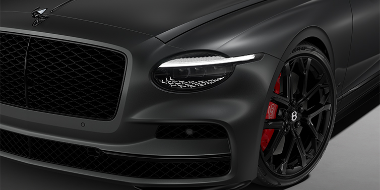 Bach Premium Cars GmbH New Bentley Flying Spur S sedan head lamp against Anthracite Satin paint with  22" Sports wheel