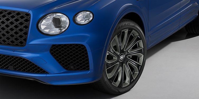 Bach Premium Cars GmbH Bentley Bentayga Artenara Edition SUV front detail in Sequin Blue paint and 22" Mulliner Gloss Black wheels front 3/4