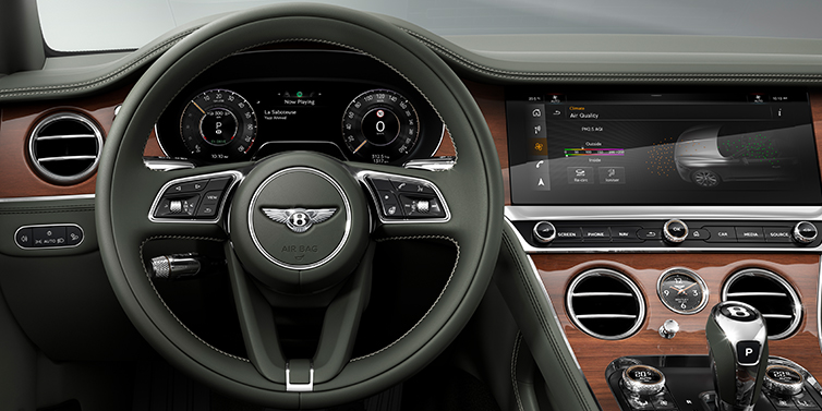 Bach Premium Cars GmbH New Bentley Continental GT coupe steering wheel and front cabin view in Cumbrian Green hide and Crown Cut walnut veneer